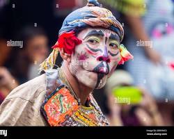 Image of Sasak traditional carnival in Lombok with dancers and performers in colorful costumes